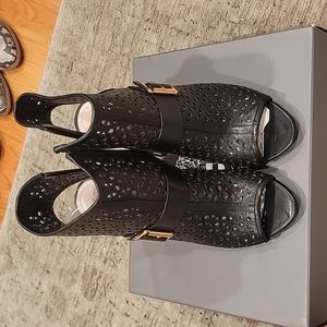 Black leather perforated peep toe ankle booties by Vince Camuto in size 9